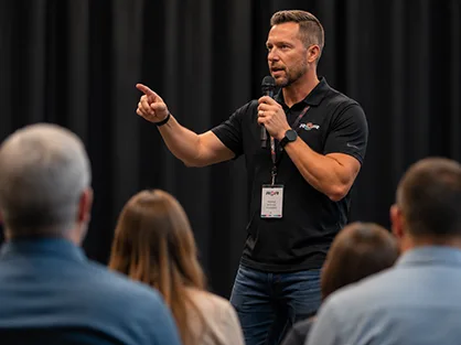 Industry leader speaking and sharing knowledge at a professional event